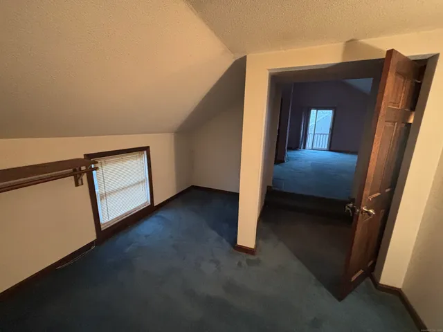 a view of front door and bedroom