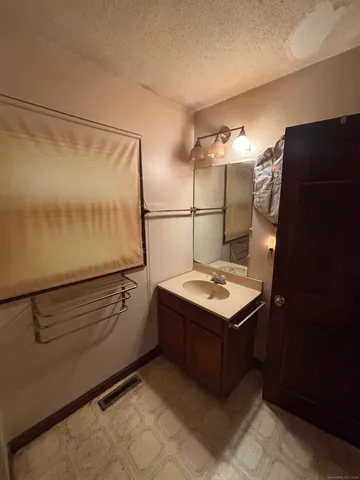 a kitchen with a cabinets and refrigerator