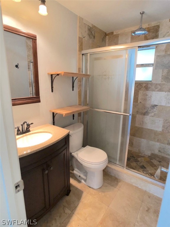 8038 Matanzas Road Fort Myers, FL 33967 - Photo 11 of 27 a bathroom with a sink toilet and shower