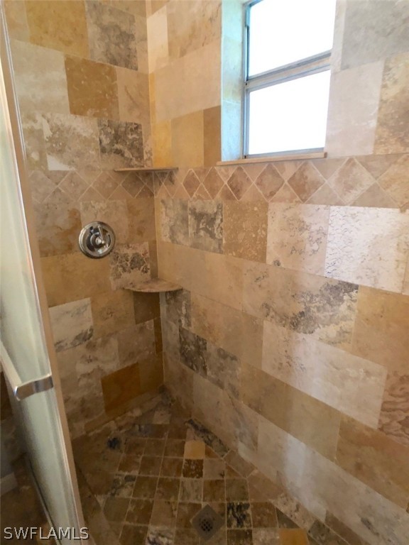 8038 Matanzas Road Fort Myers, FL 33967 - Photo 13 of 27 a bathroom with a shower