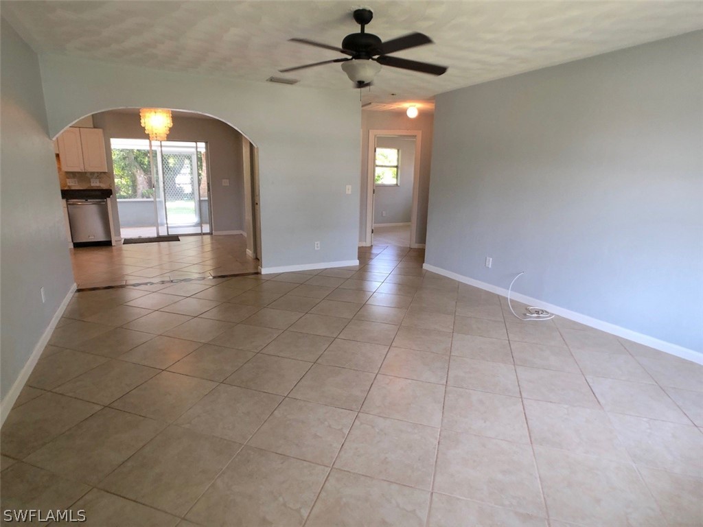 8038 Matanzas Road Fort Myers, FL 33967 - Photo 15 of 27 a view of empty room with wooden floor and fan