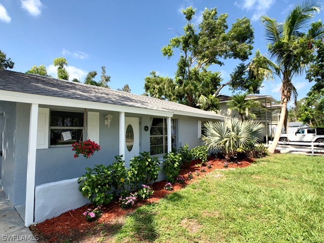 8038 Matanzas Road Fort Myers, FL 33967 - Photo 2 of 27 a view of a house with a patio