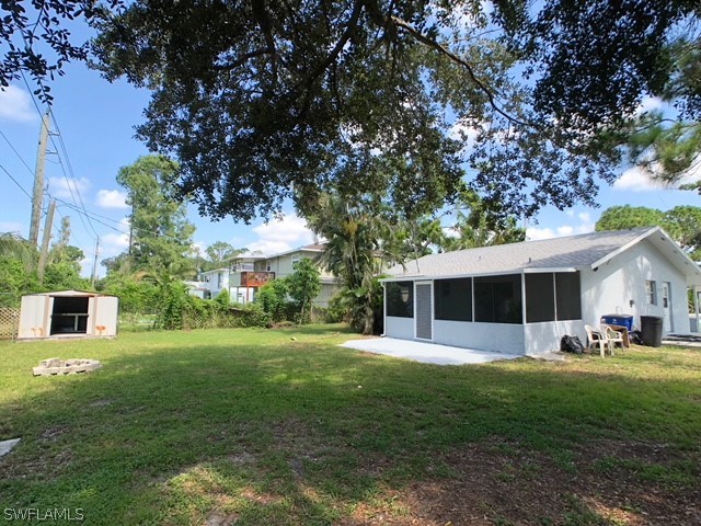 8038 Matanzas Road Fort Myers, FL 33967 - Photo 26 of 27 a front view of house with yard and green space