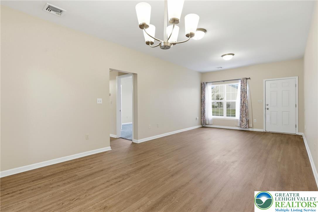 2022 Mercer Way Easton, PA 18040 - Photo 5 of 23 a view of an empty room with wooden floor