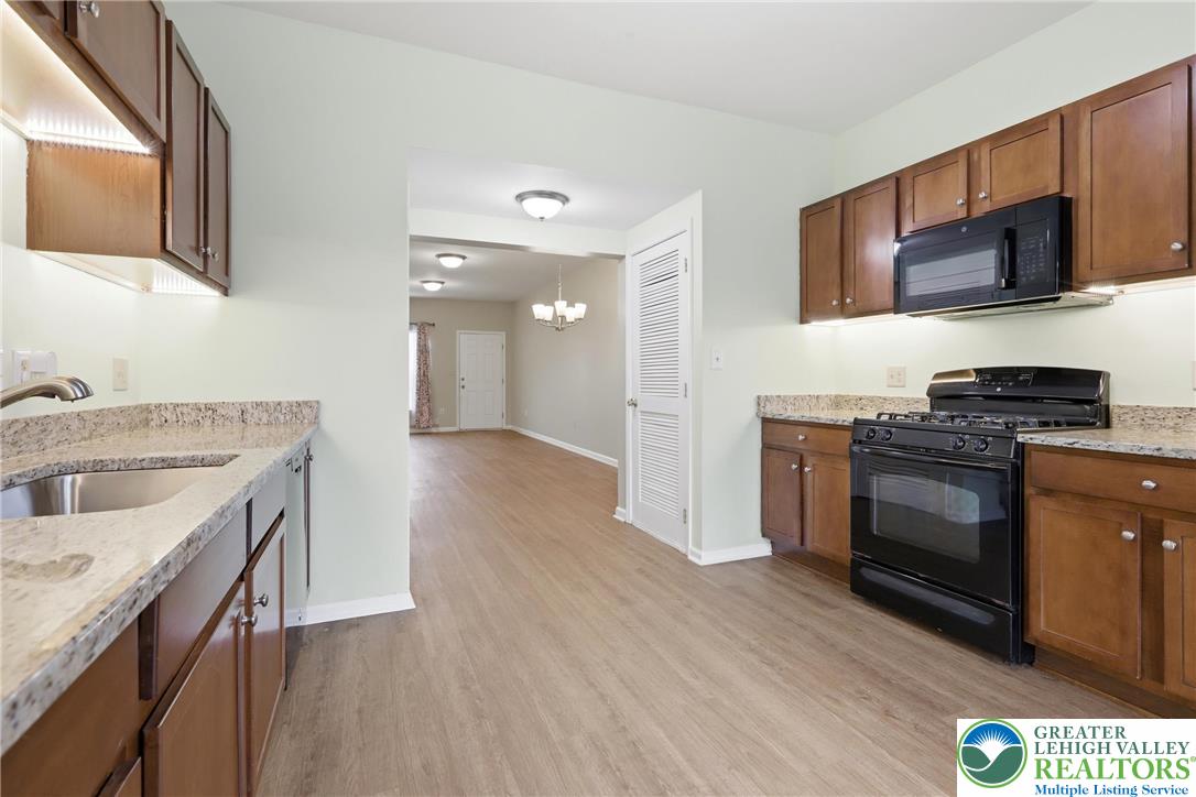 2022 Mercer Way Easton, PA 18040 - Photo 6 of 23 a kitchen with a sink stove and microwave