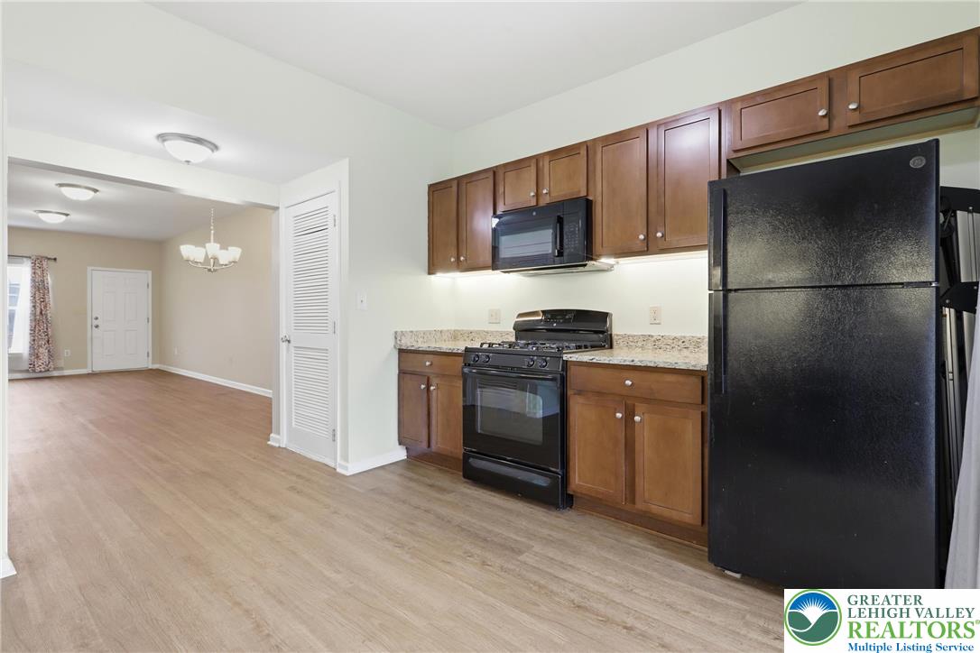 2022 Mercer Way Easton, PA 18040 - Photo 7 of 23 a kitchen with a refrigerator and a stove top oven