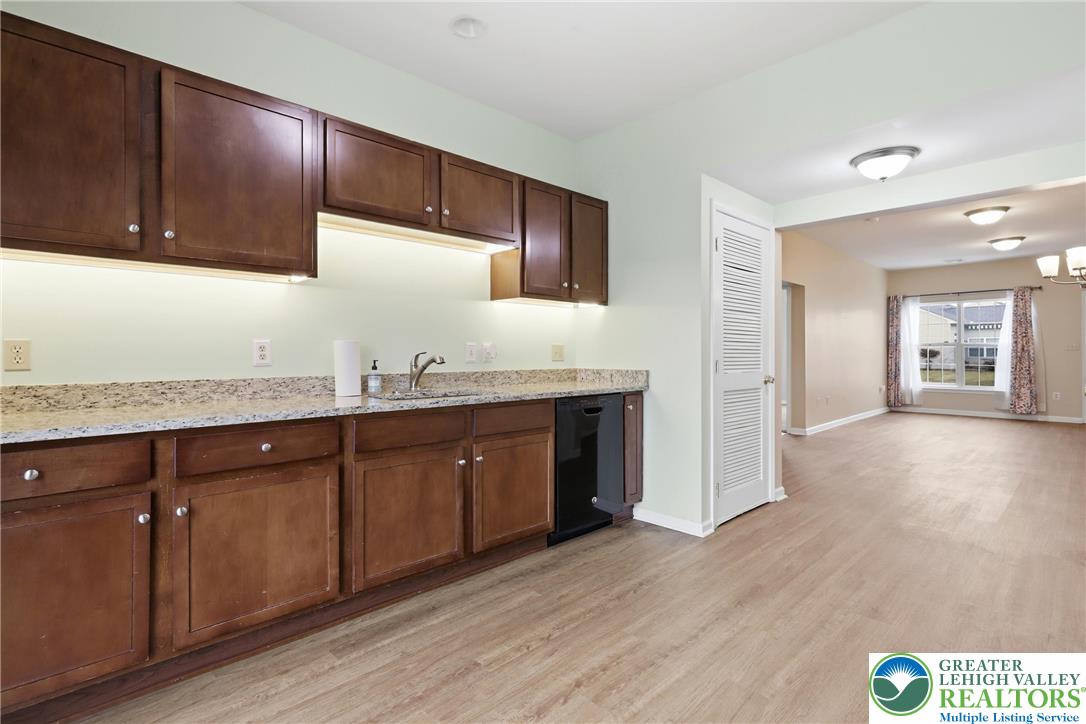 2022 Mercer Way Easton, PA 18040 - Photo 9 of 23 a kitchen with granite countertop wooden cabinets a sink and dishwasher