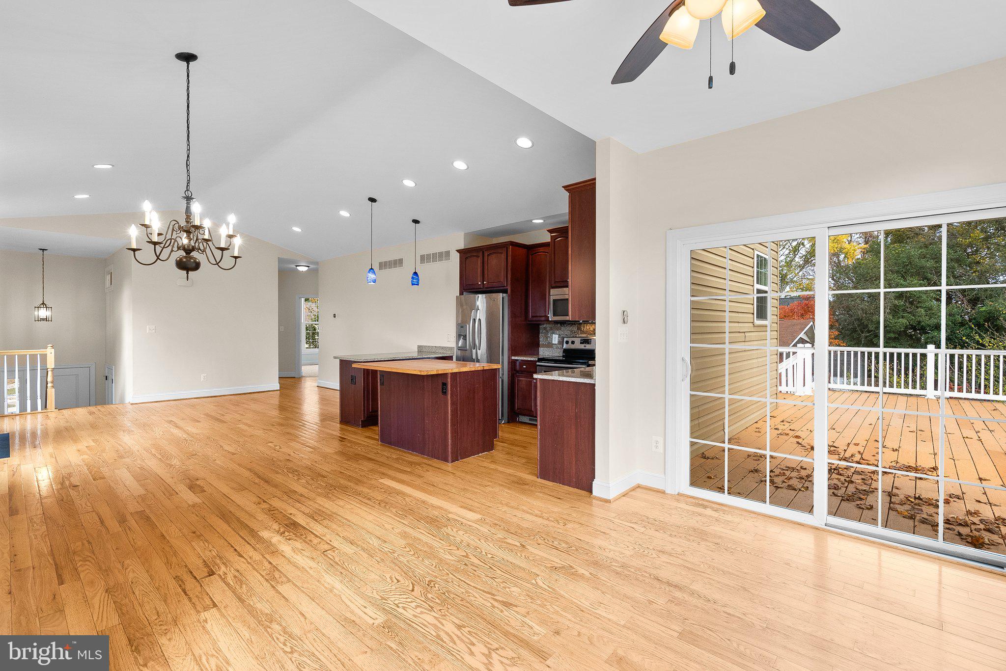 265 Lake Riviera Road Pasadena, MD 21122 - Photo 14 of 37 Living Room w/ Hardwood Floors open to Kitchen