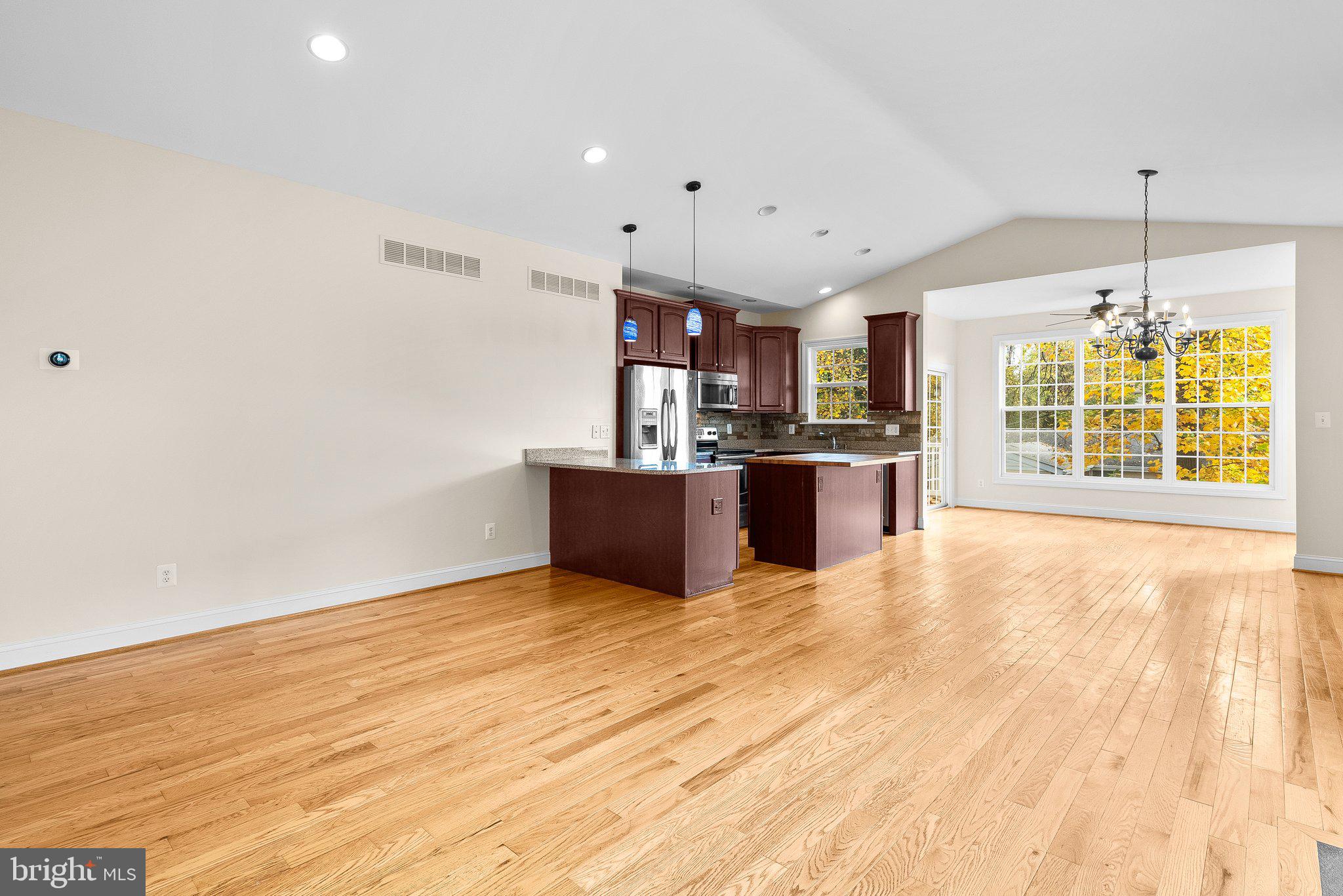 265 Lake Riviera Road Pasadena, MD 21122 - Photo 3 of 37 Open Concept w/ Pitched Ceiling and Hardwood Floor