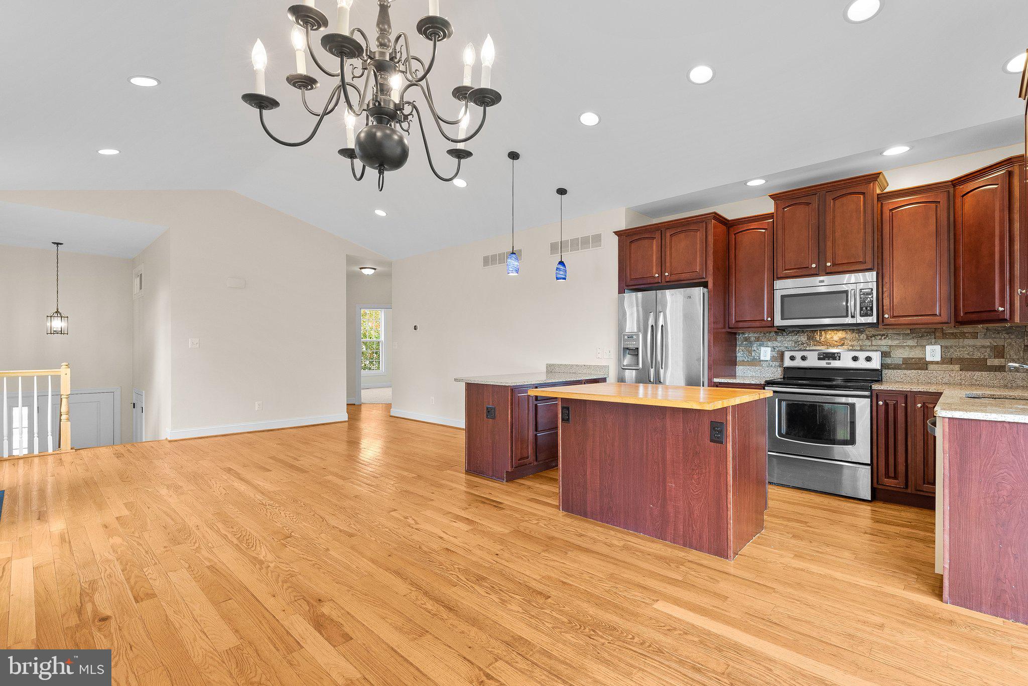 265 Lake Riviera Road Pasadena, MD 21122 - Photo 5 of 37 Gourmet Kitchen w/ Island Seating and Dining Room