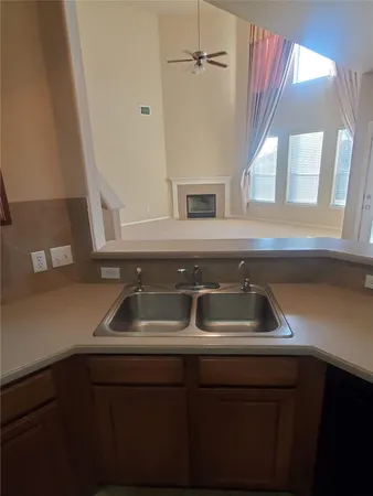 a kitchen with a sink and a window