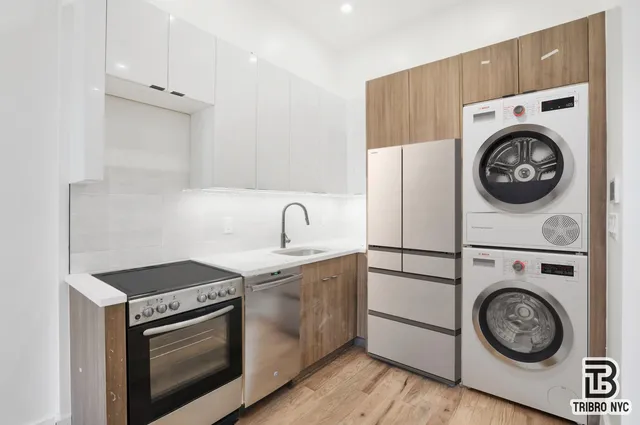 a kitchen with a stove and a sink