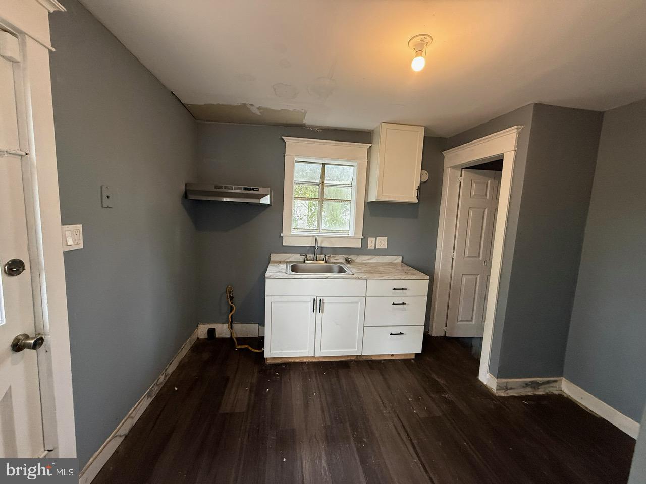 91 Summit Avenue Bridgeton, NJ 08302 - Photo 12 of 20 a room with window closet and wooden floor