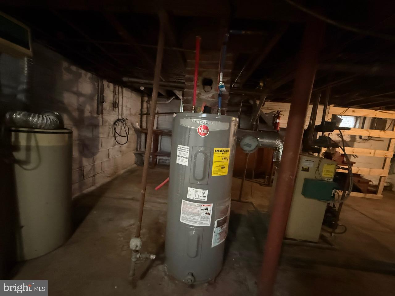 91 Summit Avenue Bridgeton, NJ 08302 - Photo 17 of 20 a view of water heater room with wooden floor