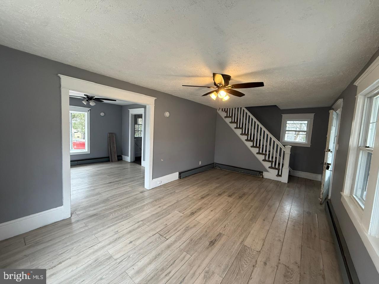 91 Summit Avenue Bridgeton, NJ 08302 - Photo 6 of 20 wooden floor in an empty room with a window