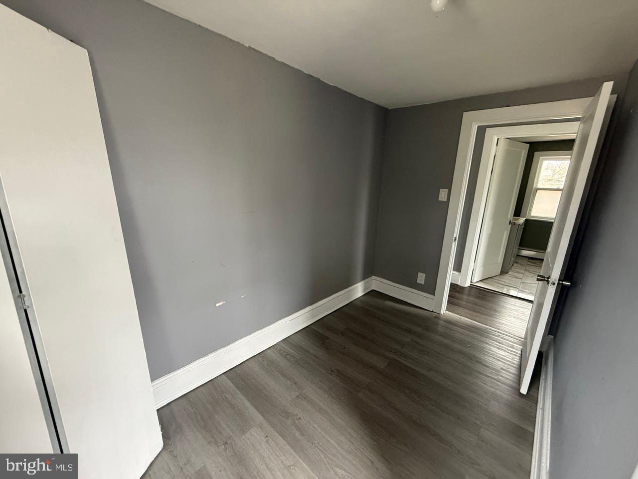 91 Summit Avenue Bridgeton, NJ 08302 - Photo 7 of 20 an empty room with wooden floor and entrance