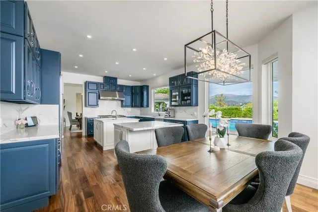 a view of kitchen and dining area with a large window