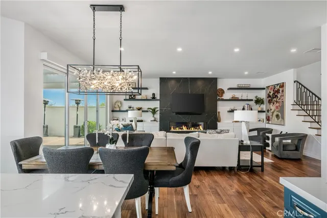 a living room with fireplace furniture and a flat screen tv