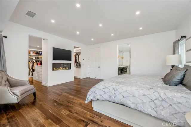 a spacious bathroom with double vanity and a shower