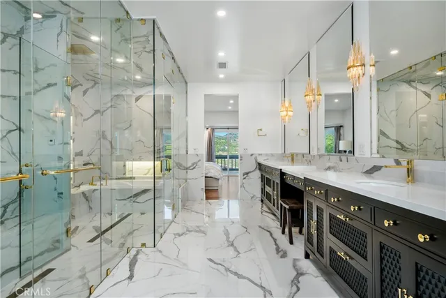 a spacious bathroom with a double vanity sink a large mirror and shower