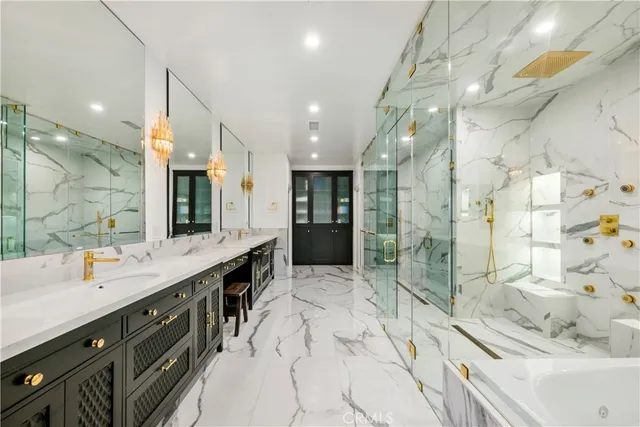 a bathroom with a bathtub and a shower