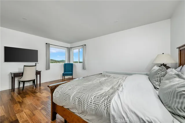 a bathroom with a double vanity sink toilet and shower