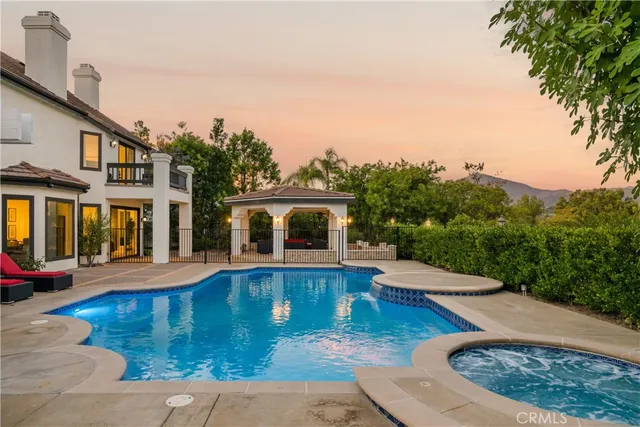 an aerial view of residential house with outdoor space and parking