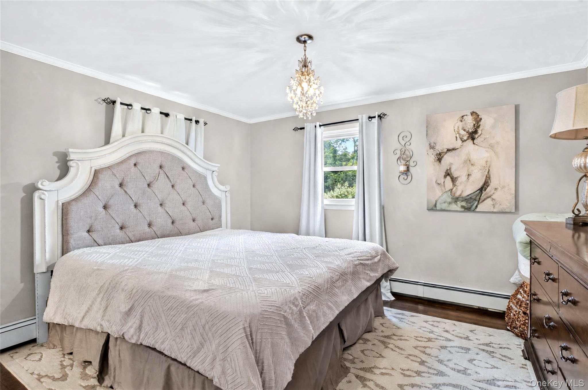 53 Harkin Road Carmel, NY 10512 - Photo 10 of 22 Primary bedroom with hardwood floors and marbled bath.