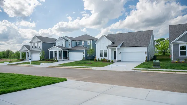 a view of house with outdoor space and trees