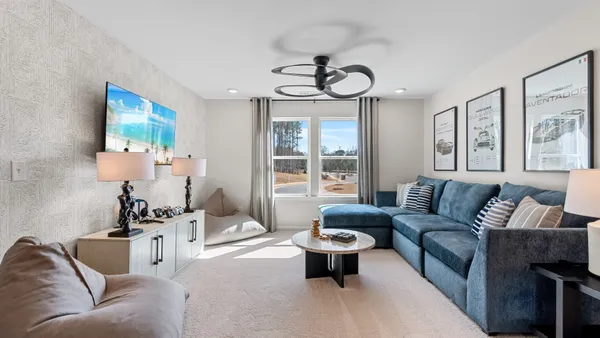 a bed room with a bed and a chandelier