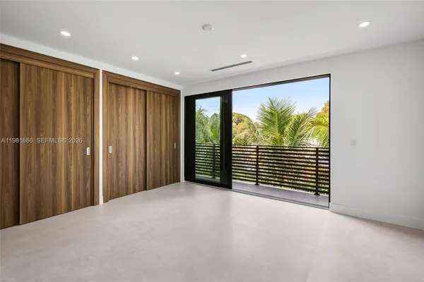 a view of a big room with windows