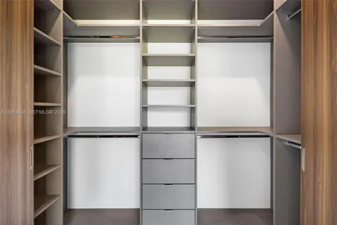 a view of an empty walk in closet