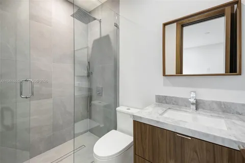 a view of an empty room with a large window