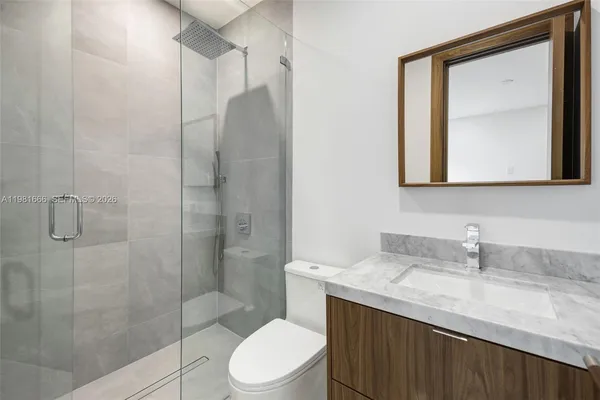 a view of an empty room with a large window