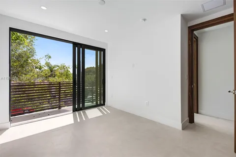 an empty room with entrance and window