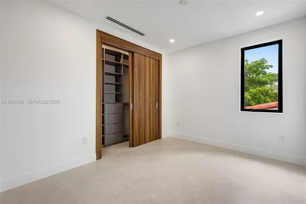 a view of balcony with furniture