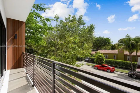 a bathroom with a granite countertop sink toilet a mirror and shower