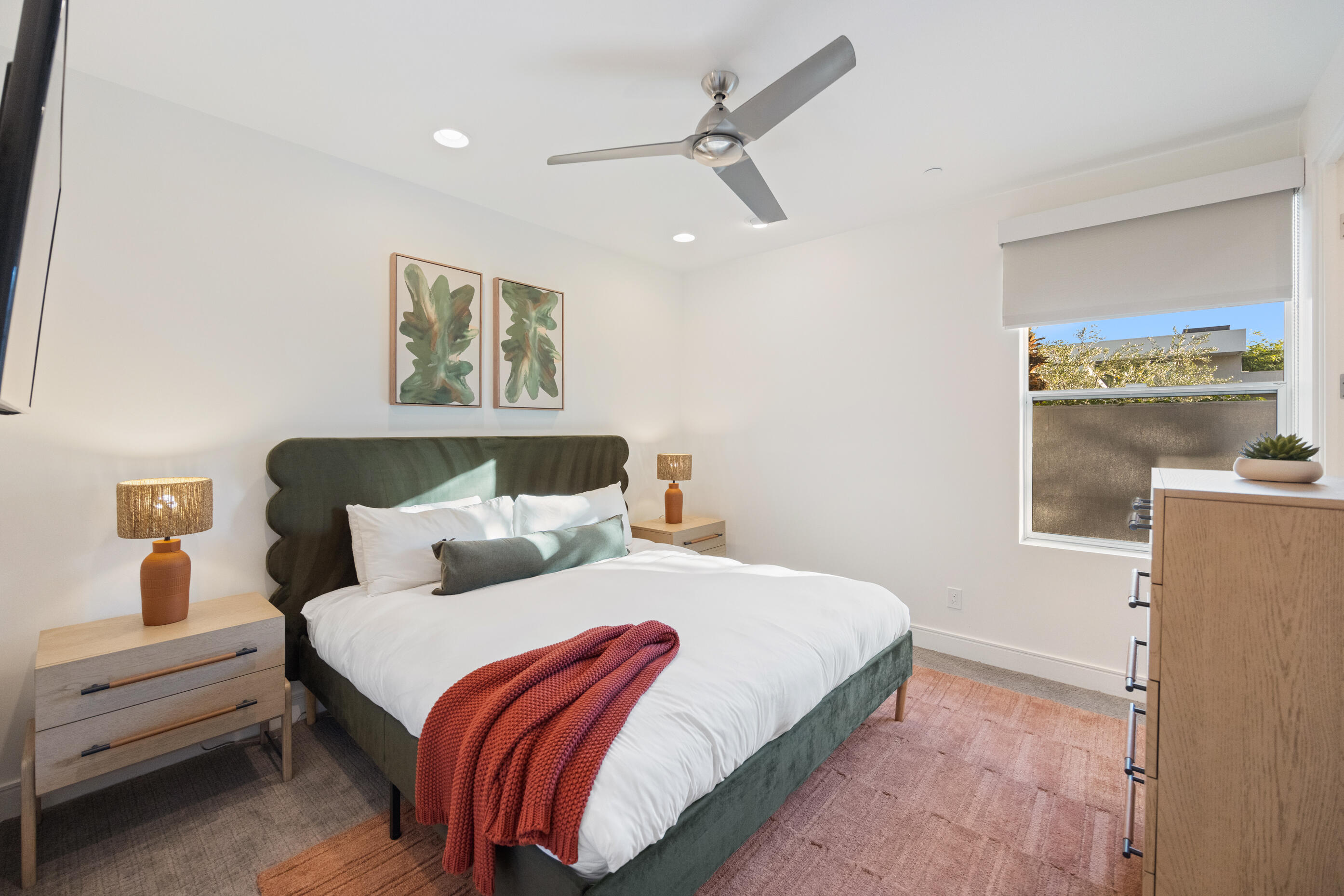 51165 Evangeline Way La Quinta, CA 92253 - Photo 21 of 48 a bedroom with a bed and glass window