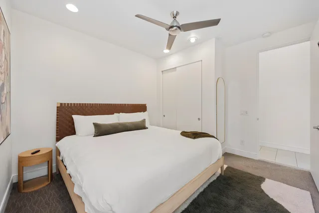 a view of a house with swimming pool and sitting area