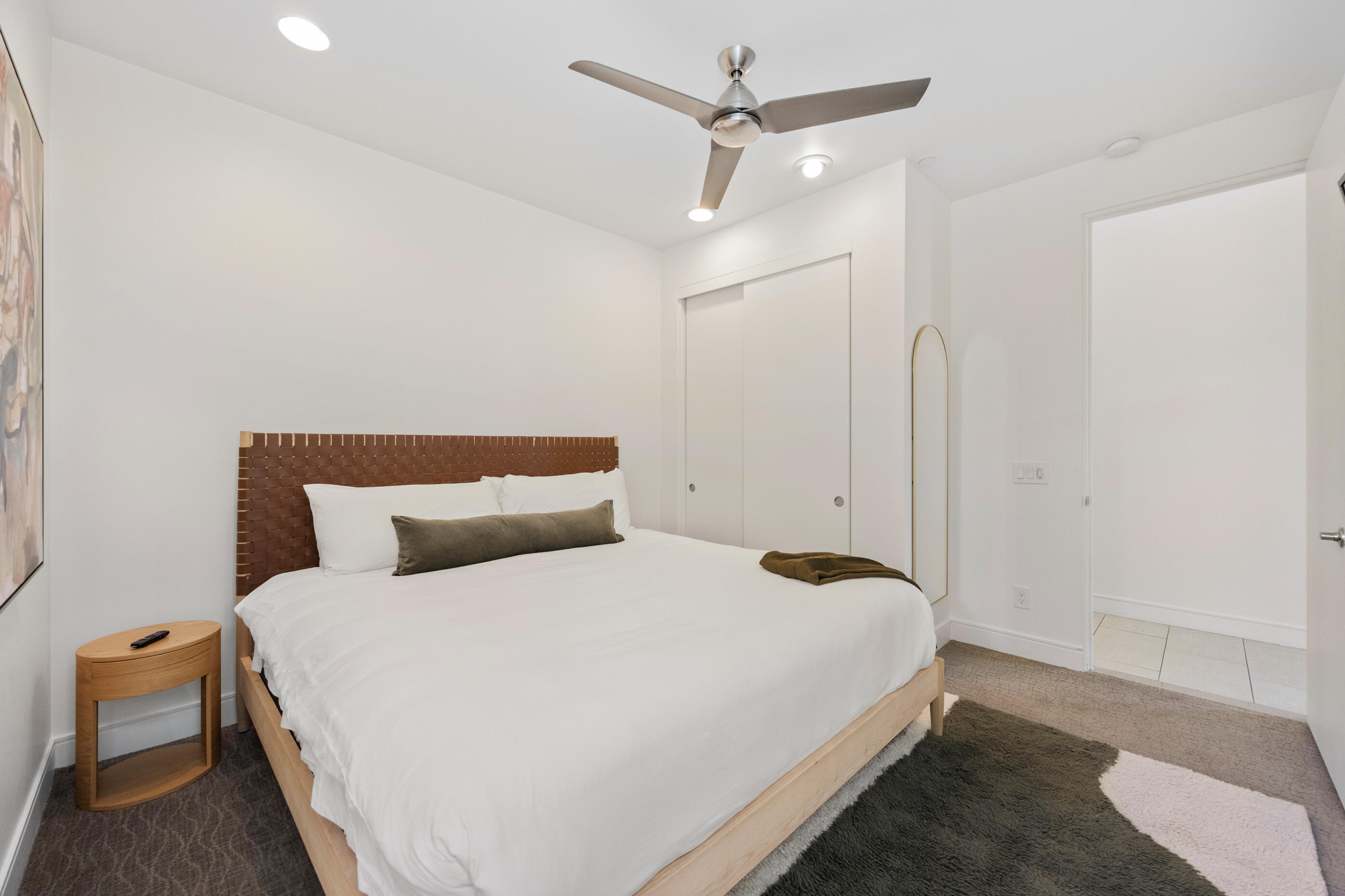 51165 Evangeline Way La Quinta, CA 92253 - Photo 24 of 48 a bedroom with a bed and a chandelier