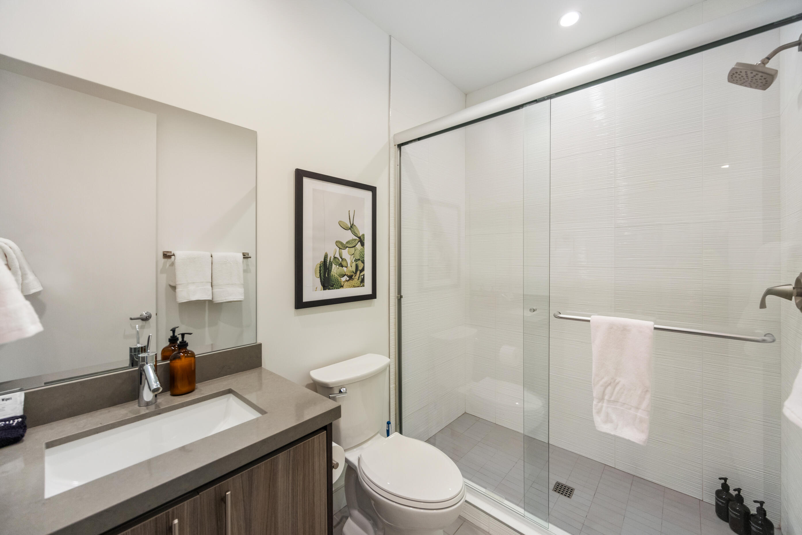 51165 Evangeline Way La Quinta, CA 92253 - Photo 29 of 48 a bathroom with a sink a toilet and shower