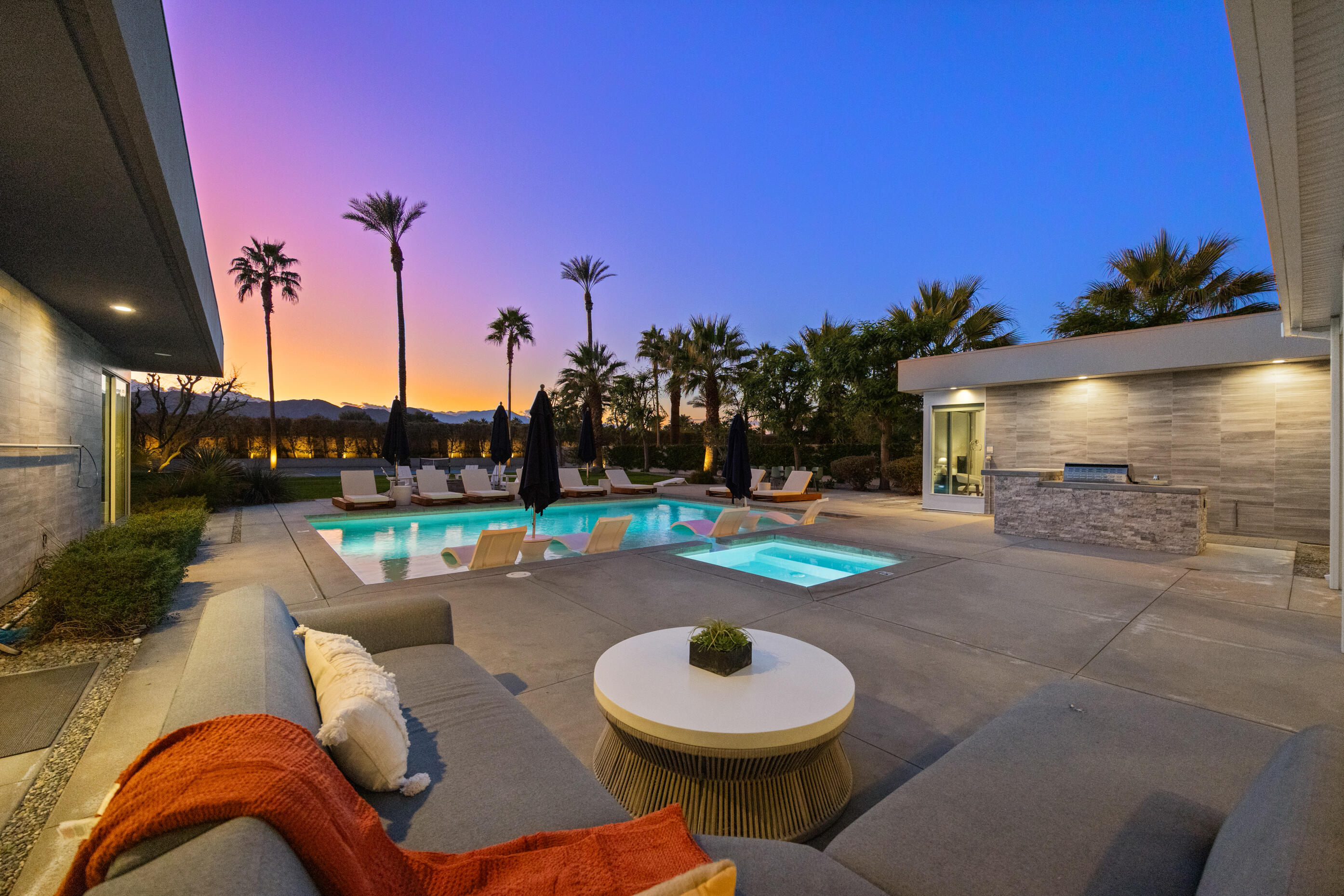 51165 Evangeline Way La Quinta, CA 92253 - Photo 36 of 48 a backyard of a house with fire pit and outdoor seating