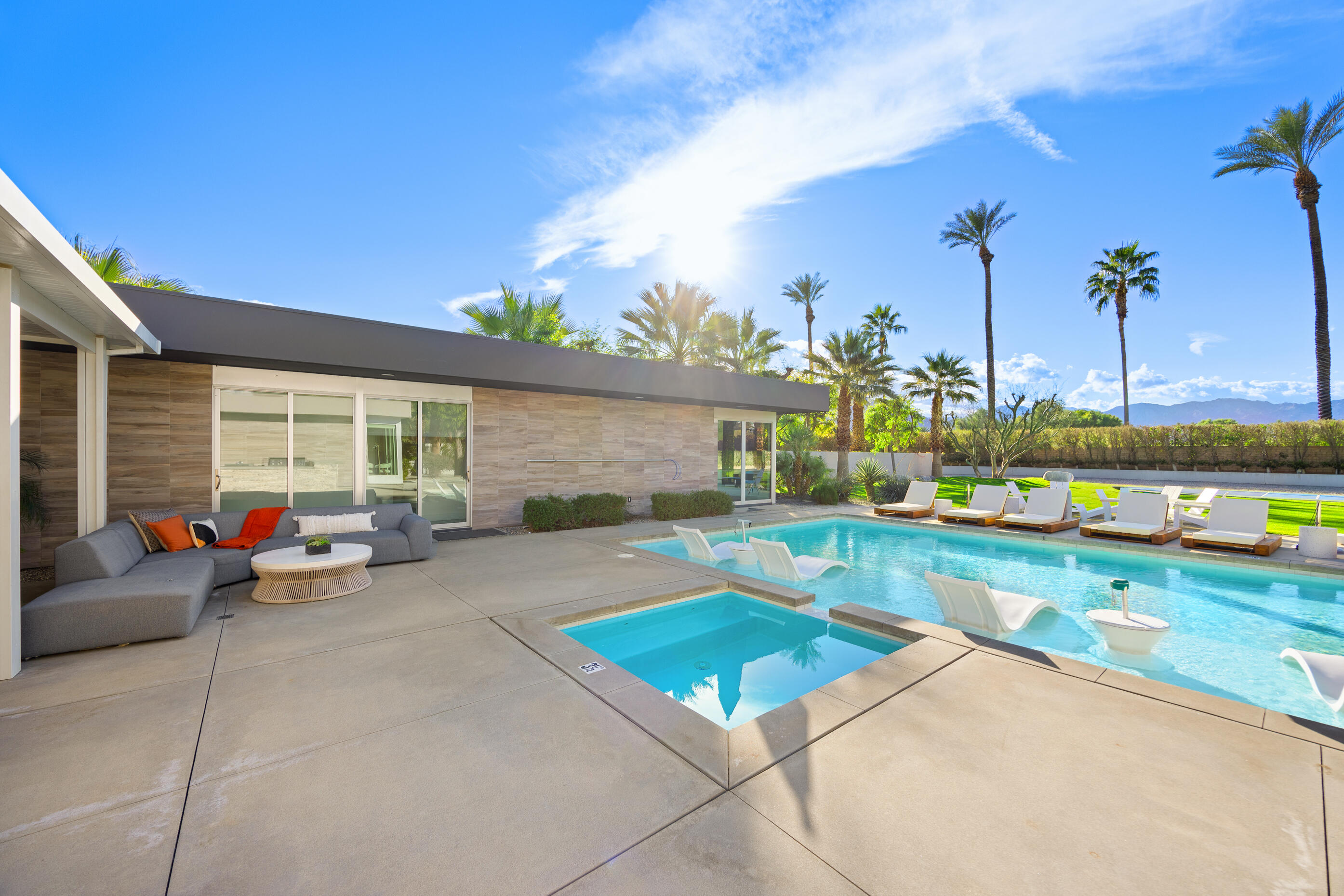 51165 Evangeline Way La Quinta, CA 92253 - Photo 39 of 48 a view of a house with swimming pool and sitting area