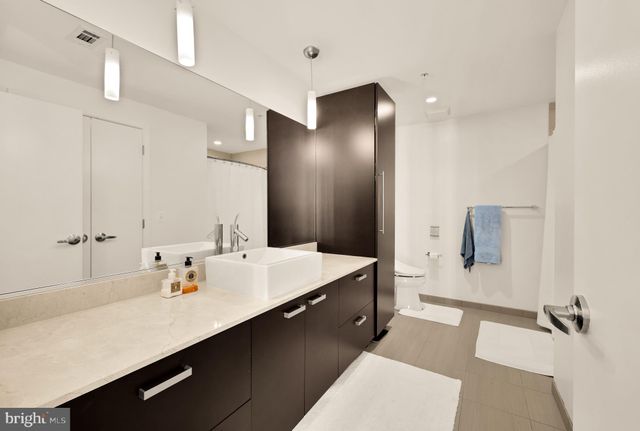 a bathroom with a sink double vanity and a mirror