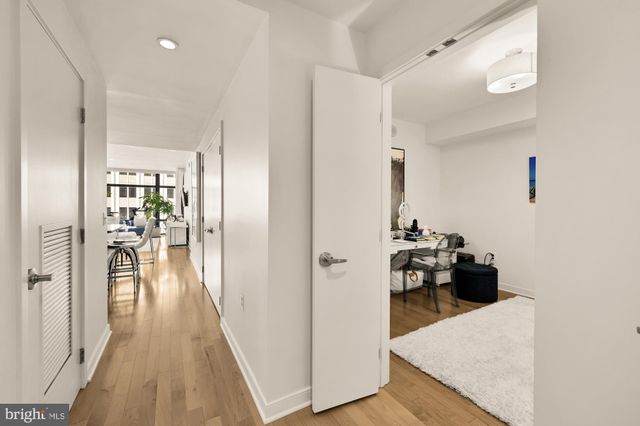 a view of a living room with wooden floor