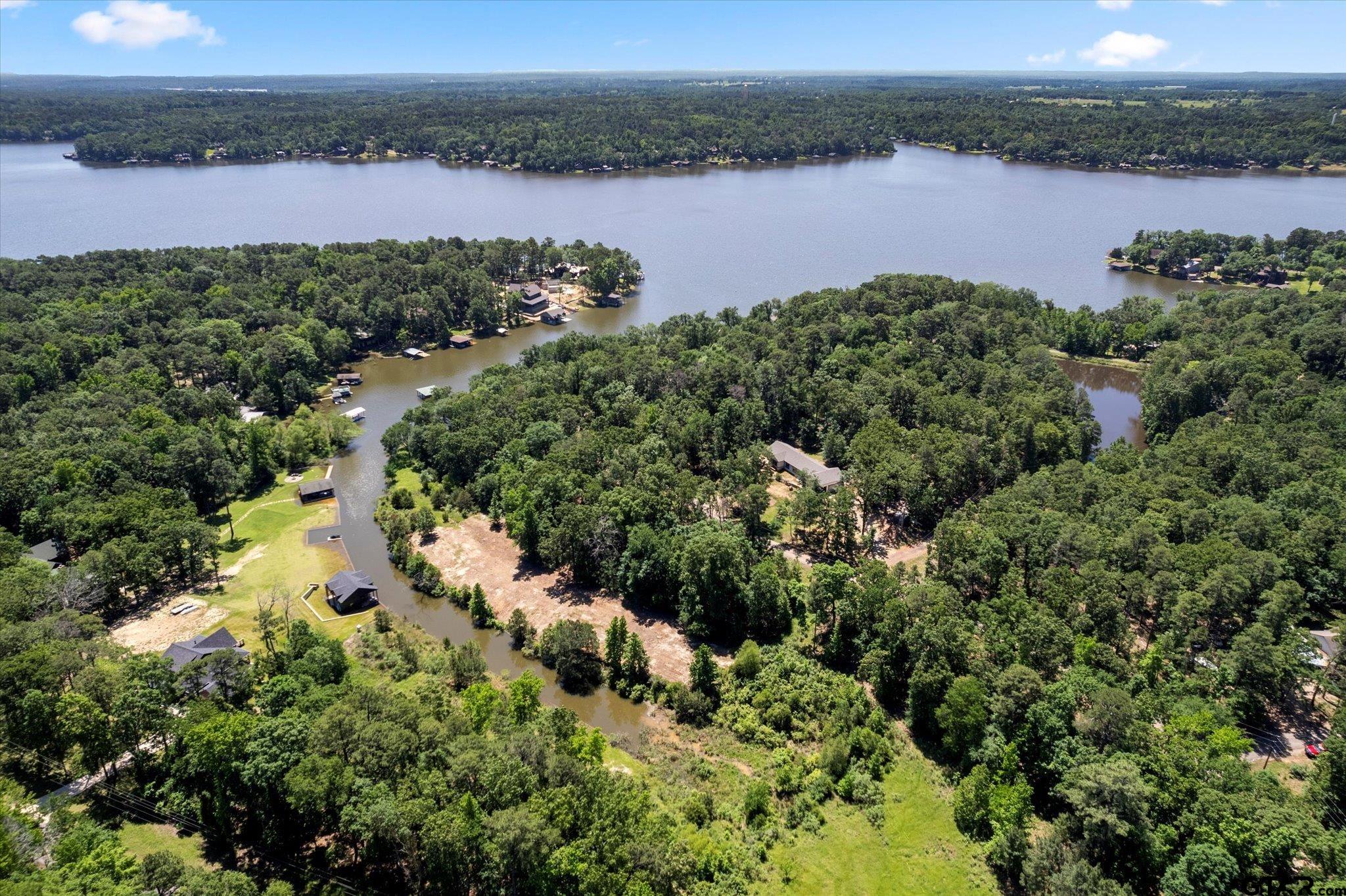 66 R King Fredrick Court Scroggins, TX 75480 - Photo 16 of 21 an aerial view of a houses with outdoor space and lake view