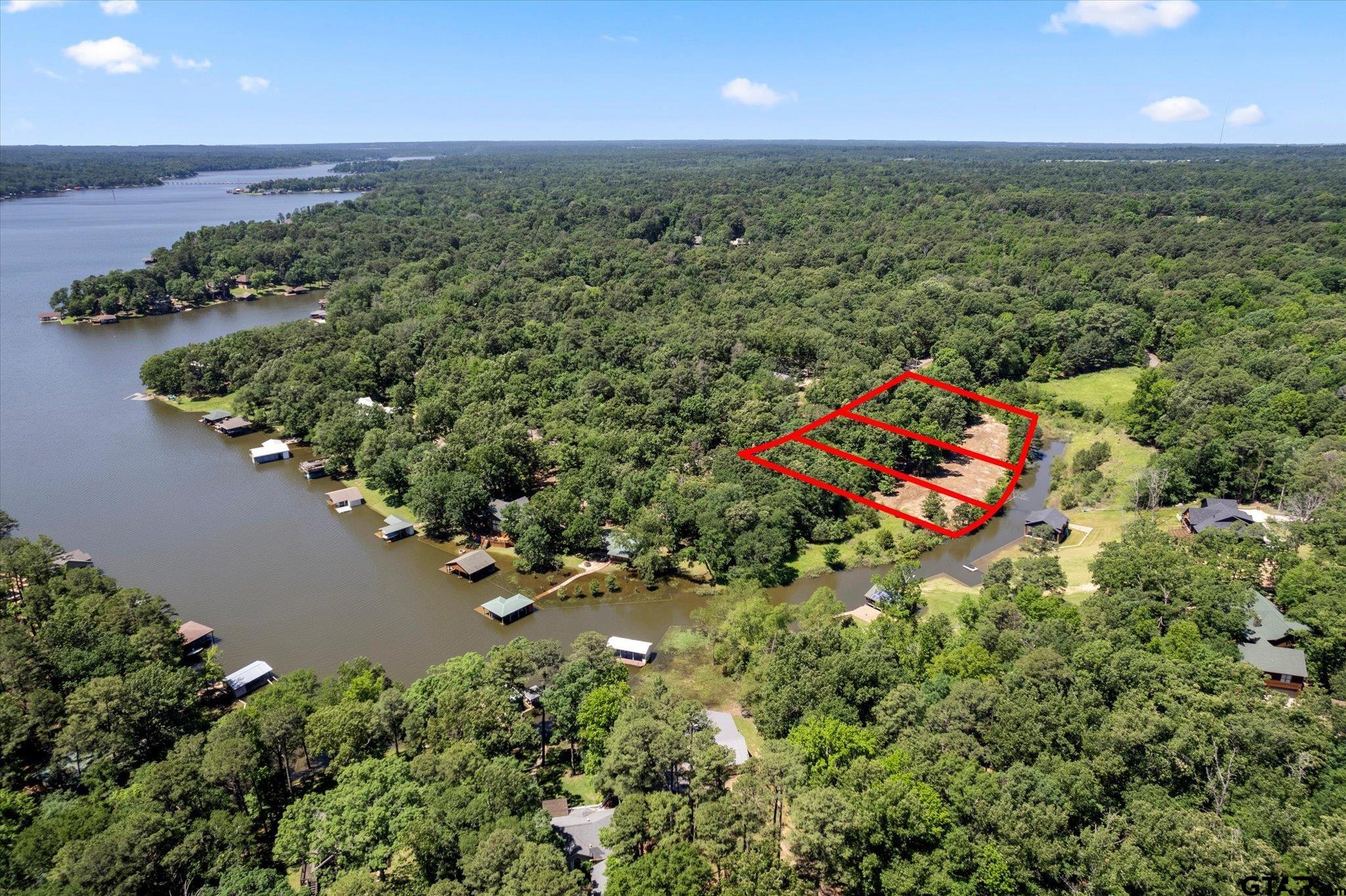 66 R King Fredrick Court Scroggins, TX 75480 - Photo 17 of 21 an aerial view of a house with a yard and lake view
