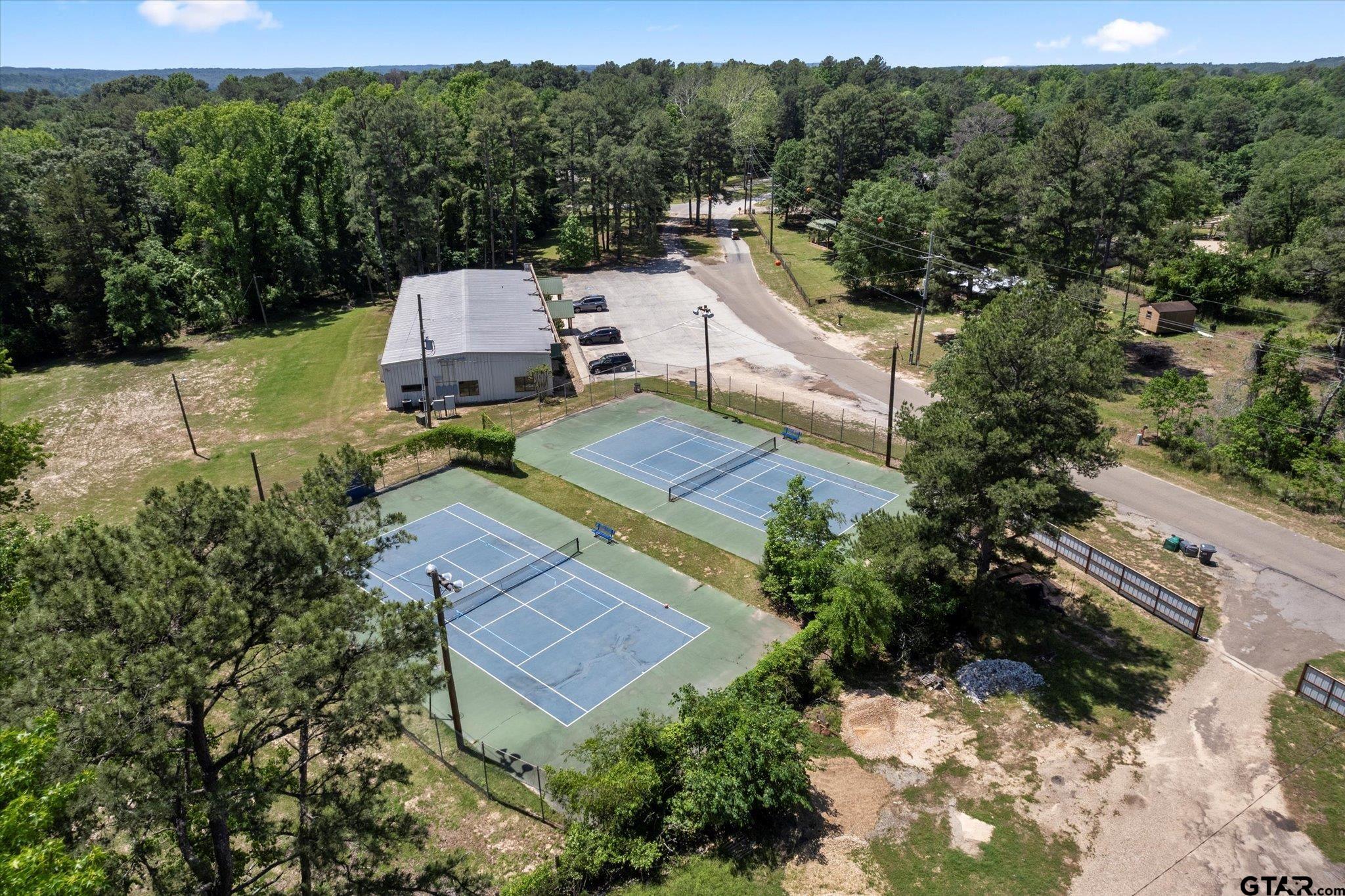 66 R King Fredrick Court Scroggins, TX 75480 - Photo 20 of 21 an aerial view of a house with a garden