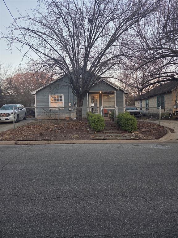 1309 South Rusk Street Sherman, TX 75090 - Photo 1 of 5 a house with trees in front of it