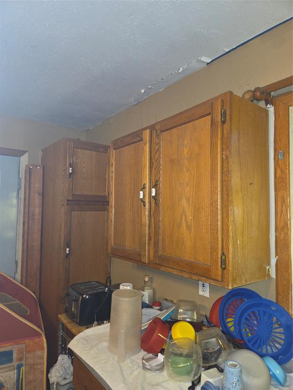 1309 South Rusk Street Sherman, TX 75090 - Photo 2 of 5 a bathroom with a sink and a mirror